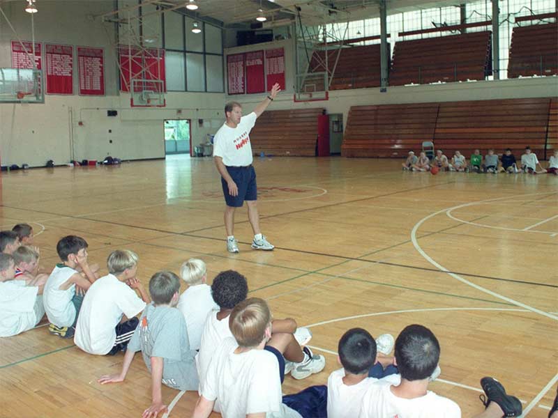 Coach Psaras talking to campers at Viking Hoops Camps